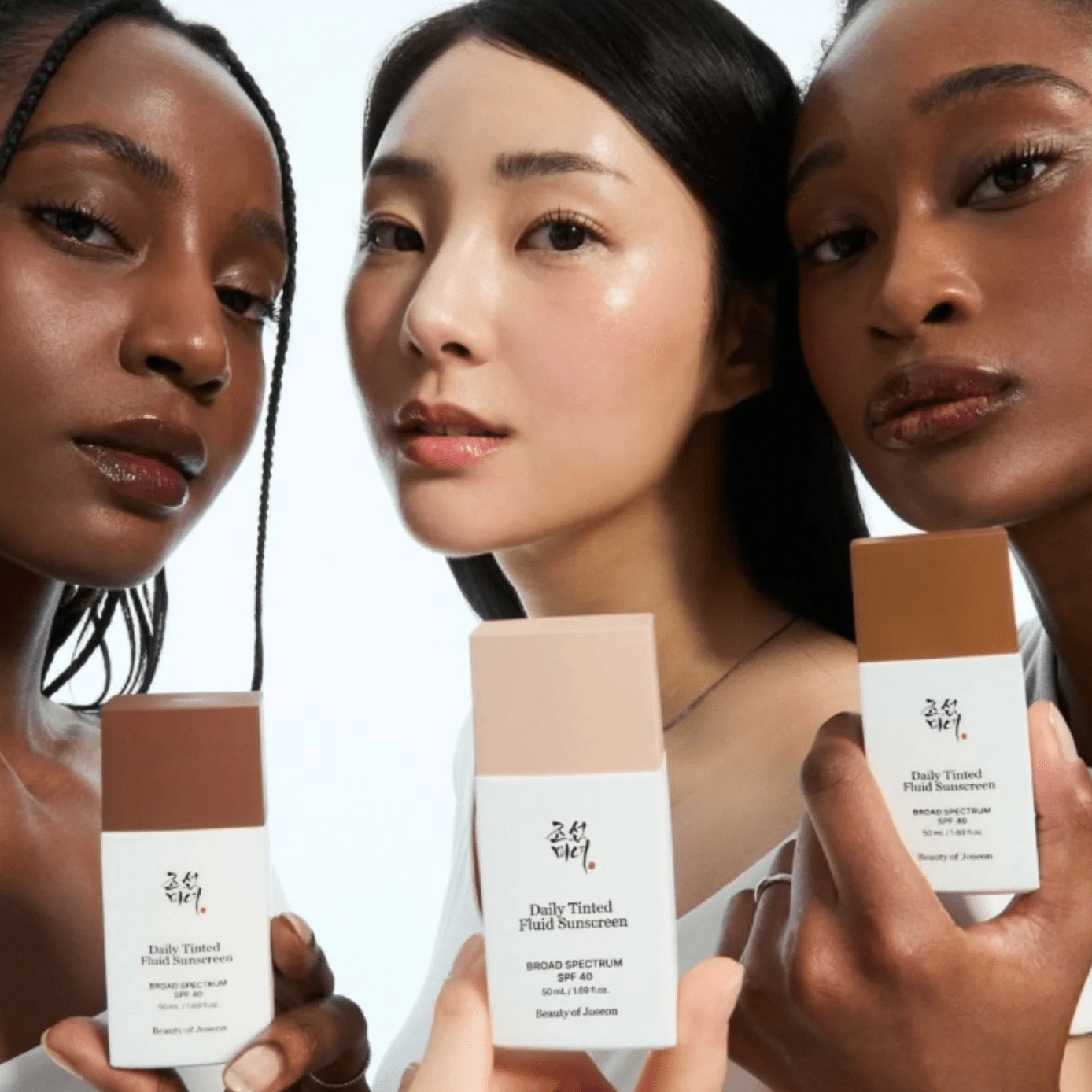 3 women holding Beauty of joseon Sunscreen