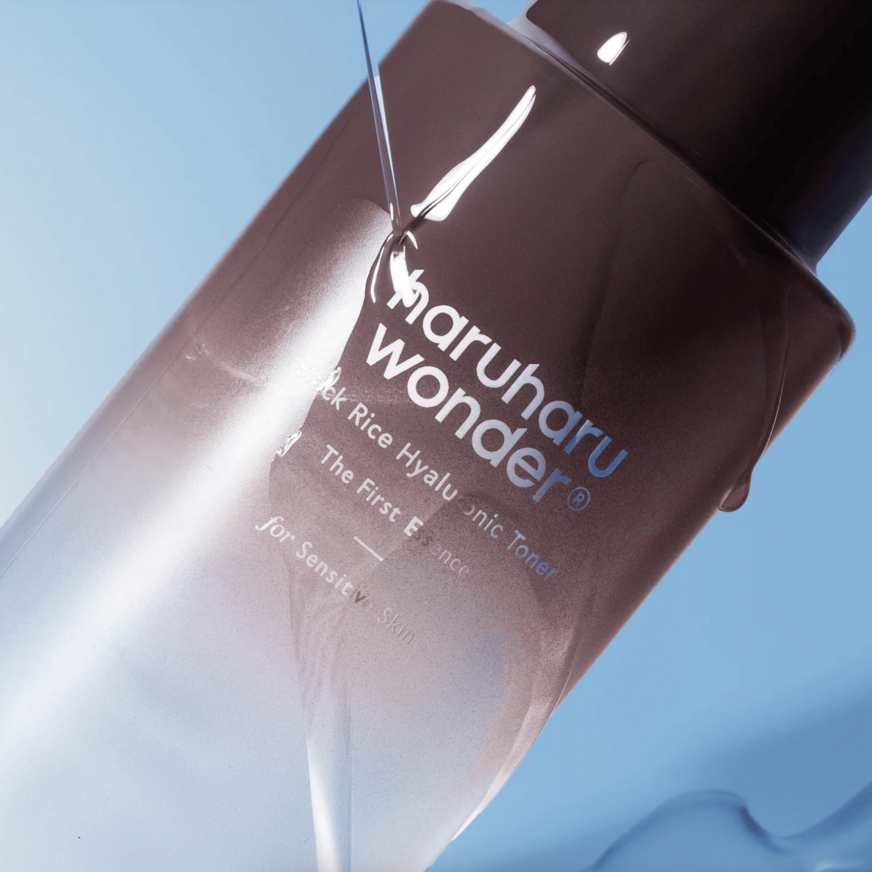 Haruharu wonder black rice hyaluronic toner close up on blue background