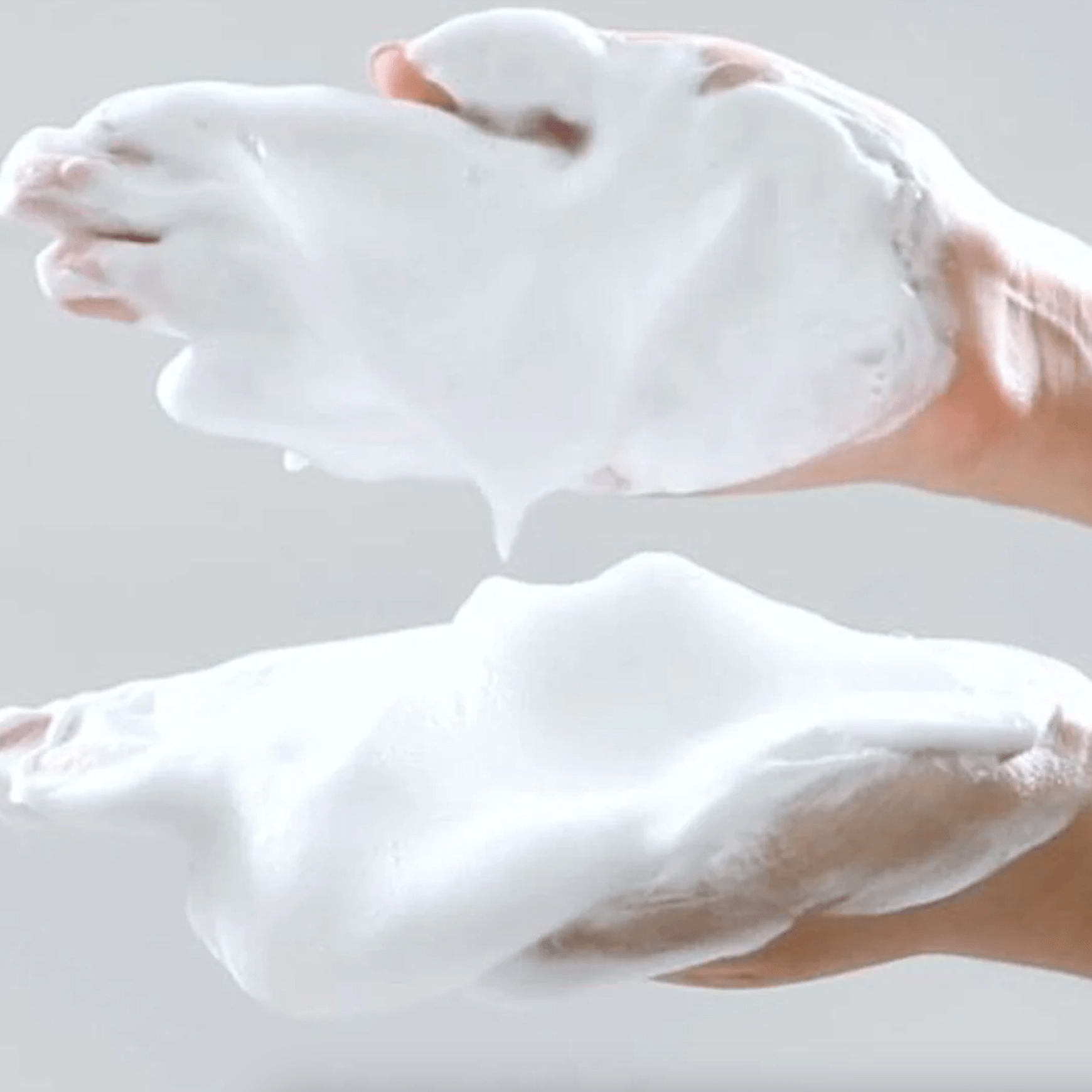 Two hands with foam