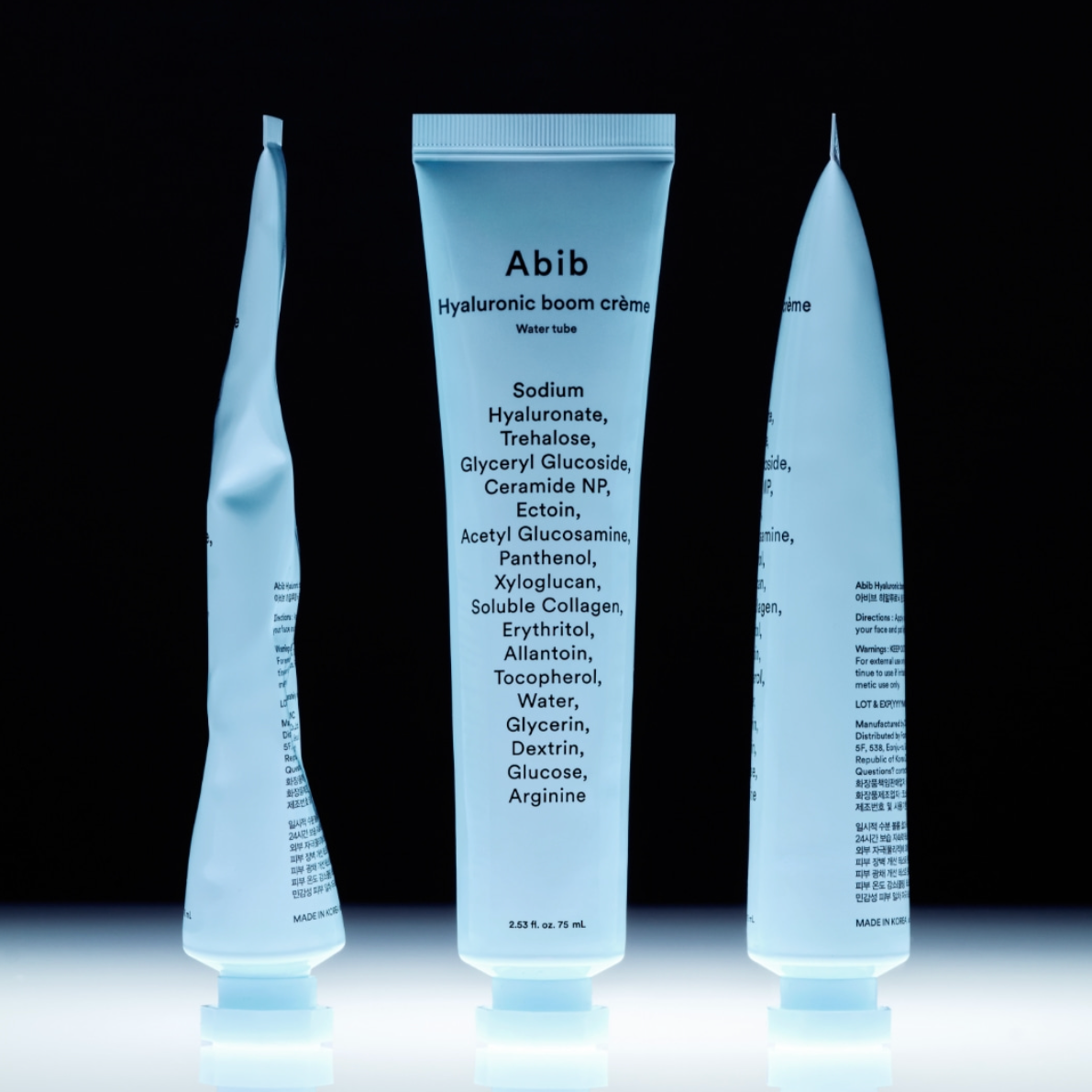 Three skincare product tubes with 'Abib' branding on a black background