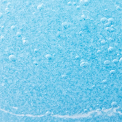 Close-up of light blue textured paper with white specks