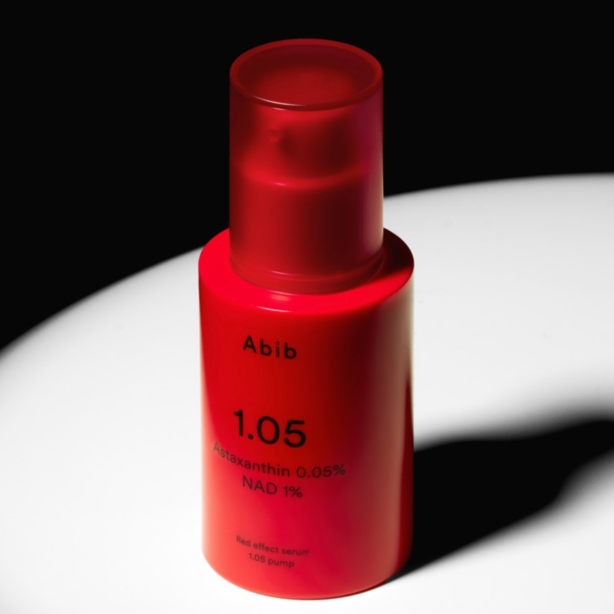 Red bottle with 'Abib' branding on a white surface