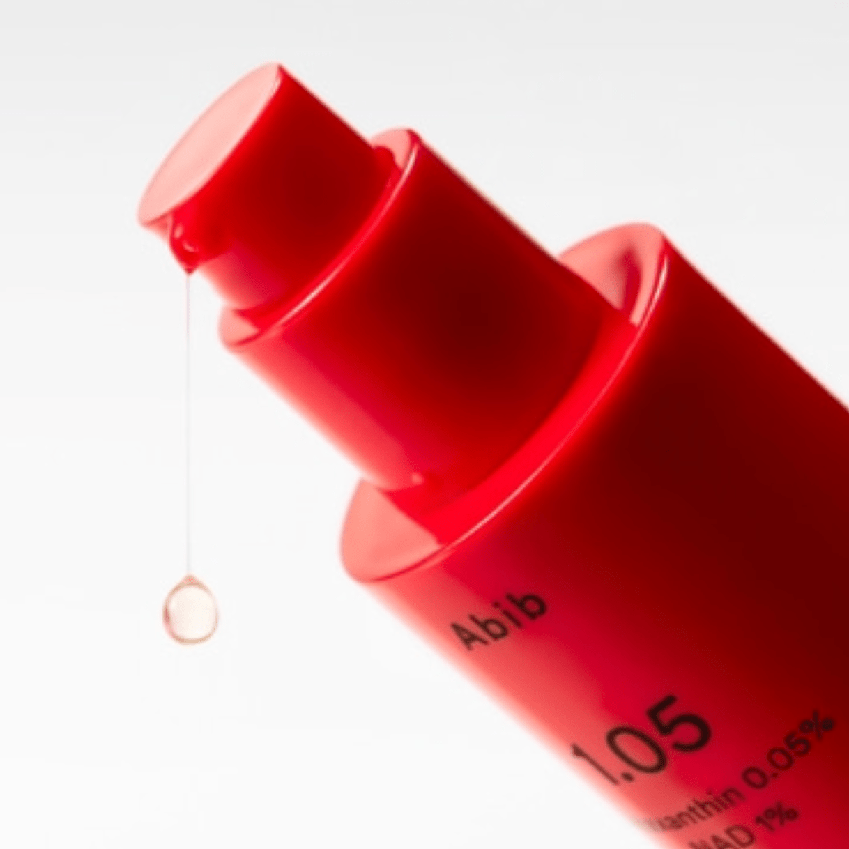 Red bottle with a dropper labeled 'Abib' on a white background