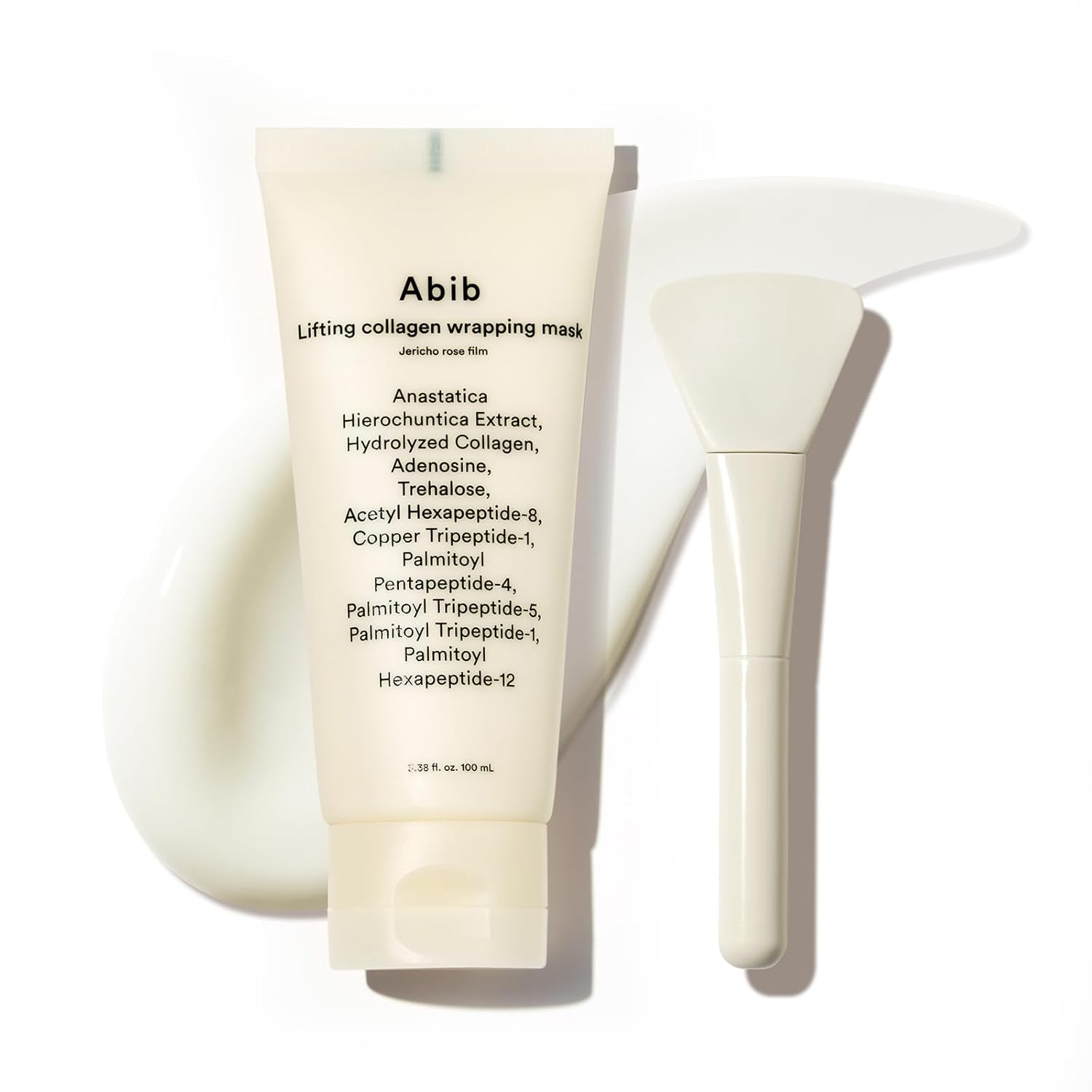 ABIB Lifting collagen wrapping mask Jericho rose film tube lays on texture with white background