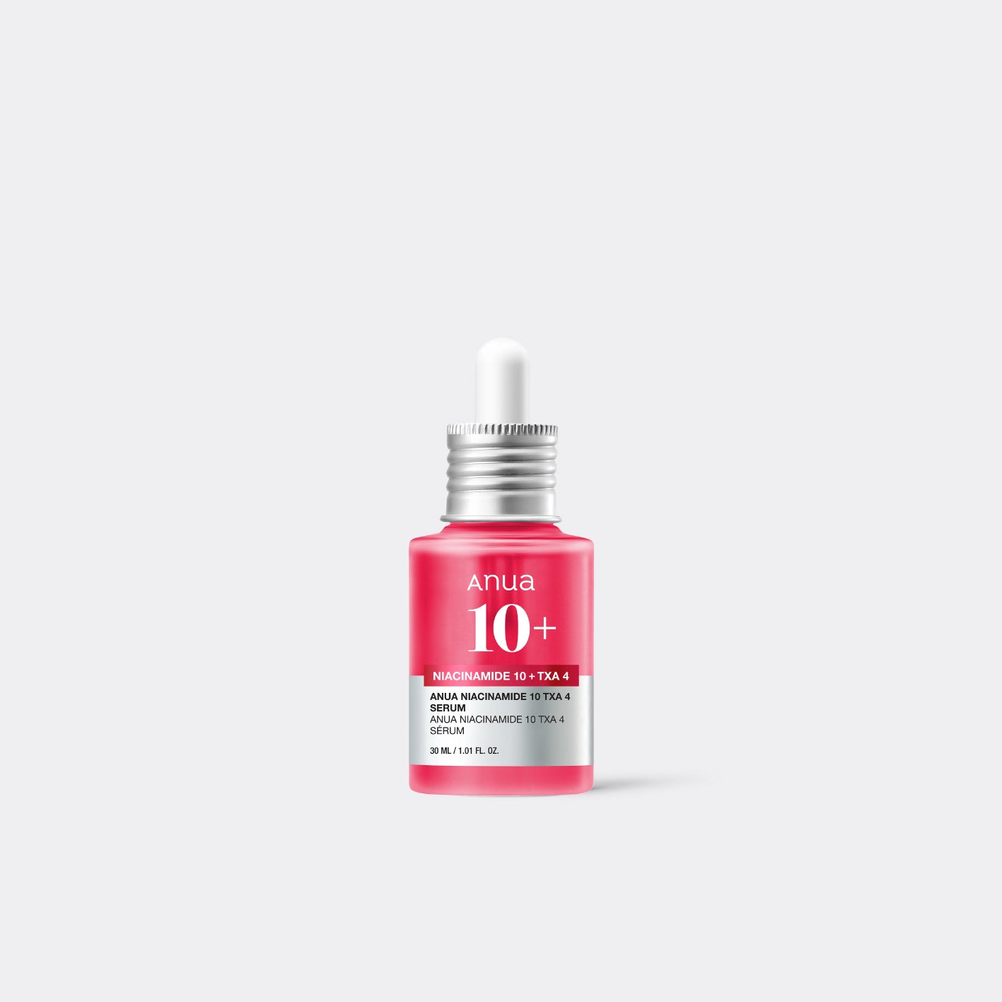 A bottle of AANUA Niacinamide 10%+TXA 4% Dark Spot Correcting Serum with a pink label on a white background