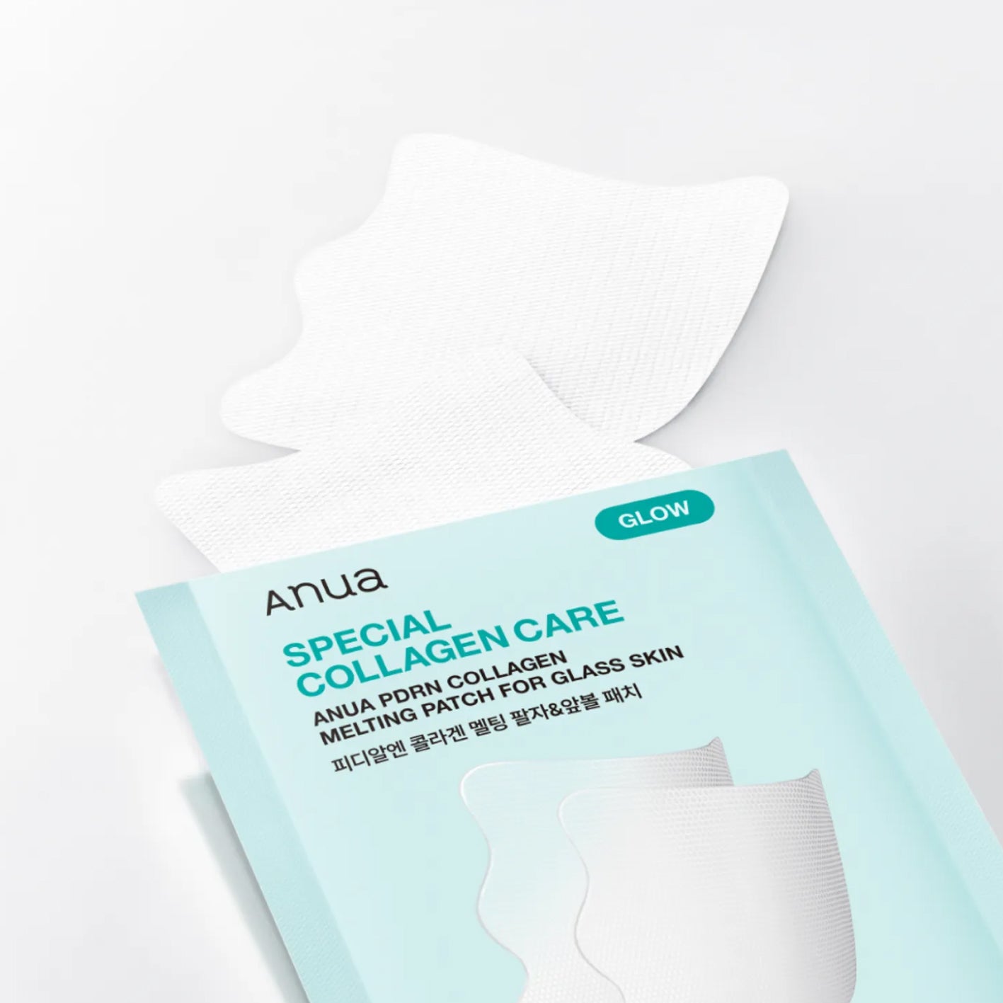 Anua Special Collagen Care melting patch for glass skin, shown with its light blue packaging and a white patch partially pulled out on a clean white background.