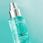 Anua skincare product with a blue label on a light blue background