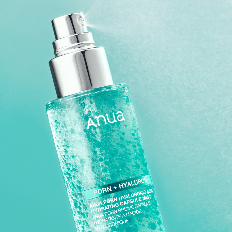 Anua skincare product with a blue label on a light blue background