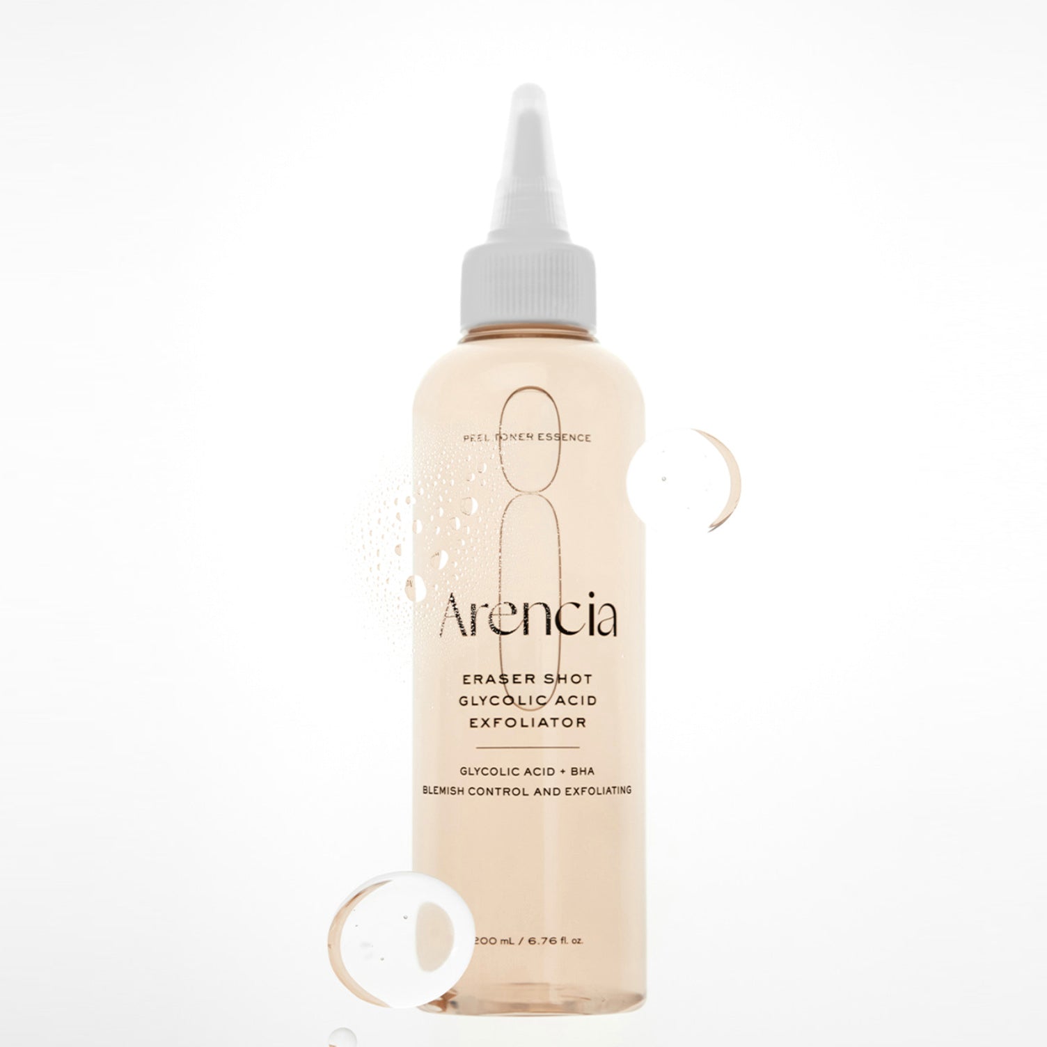 A clear plastic bottle of ARENCIA Eraser Shot Glycolic Acid Exfoliator with a white applicator cap, filled with a pale peach-colored liquid, set against a clean white background with decorative water droplets.