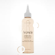 A clear plastic bottle of ARENCIA Eraser Shot Glycolic Acid Exfoliator with a white applicator cap, filled with a pale peach-colored liquid, set against a clean white background with decorative water droplets.