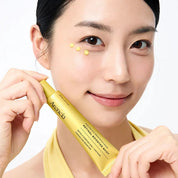 Woman holding a ARENCIA Retinal Booster Shot with a white background