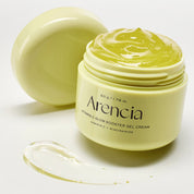 A jar of Arencia Vitamin C Glow Booster Gel Cream with its lid off, showing the pale yellow-green gel cream inside, with a smear of the gel in the foreground on a white background.