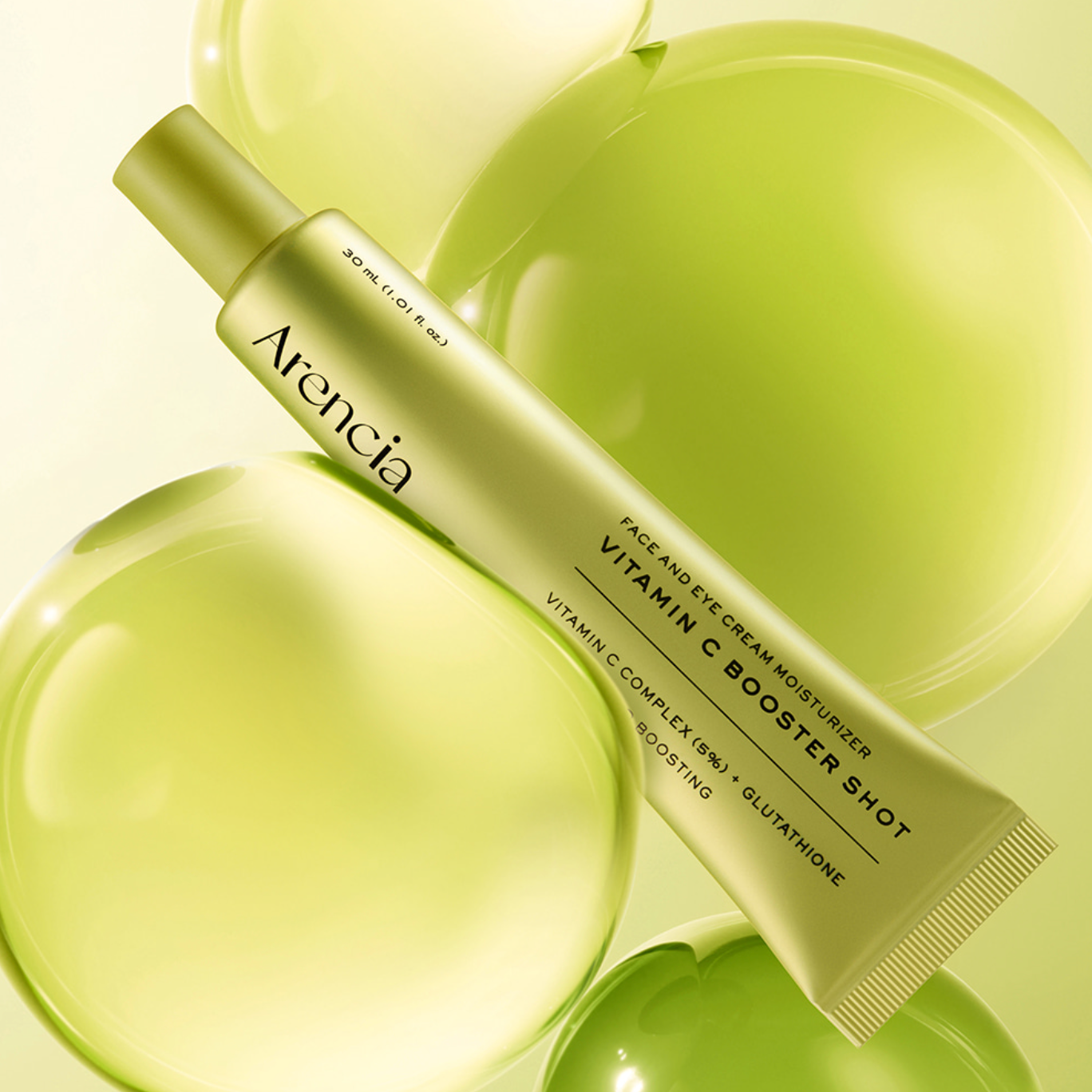 ARENCIA Vitamin C Booster Shot 30ml tube between green yellow balls