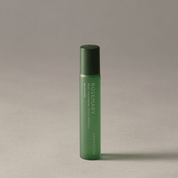AROMATICA Rosemary Root Volumizing Scalp Ampoule with black cap on a beige background