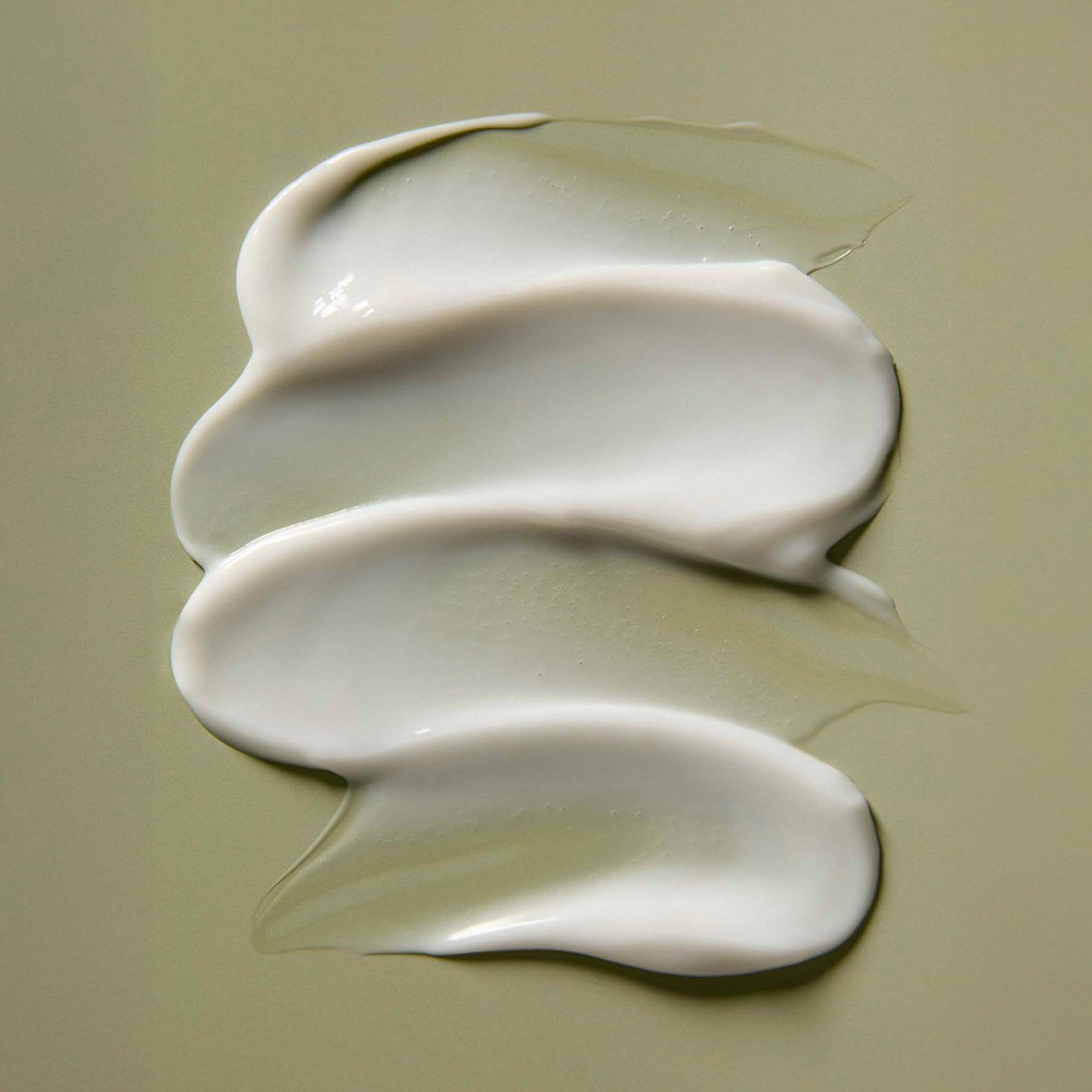 AROMATICA Rosemary Hair Thickening Conditioner white cream texture on a beige background