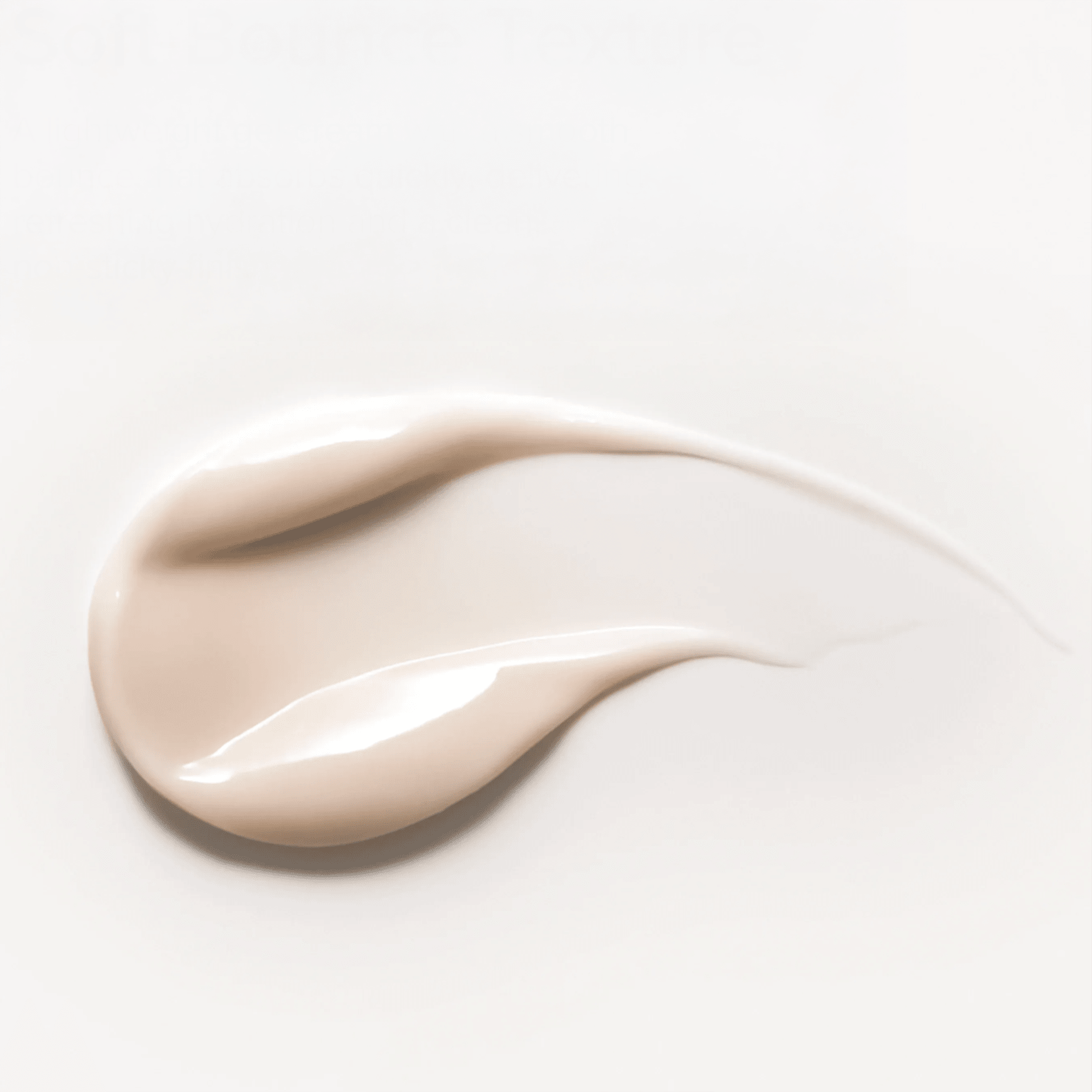 Close-up of a beige cream swatch on a light gray background
