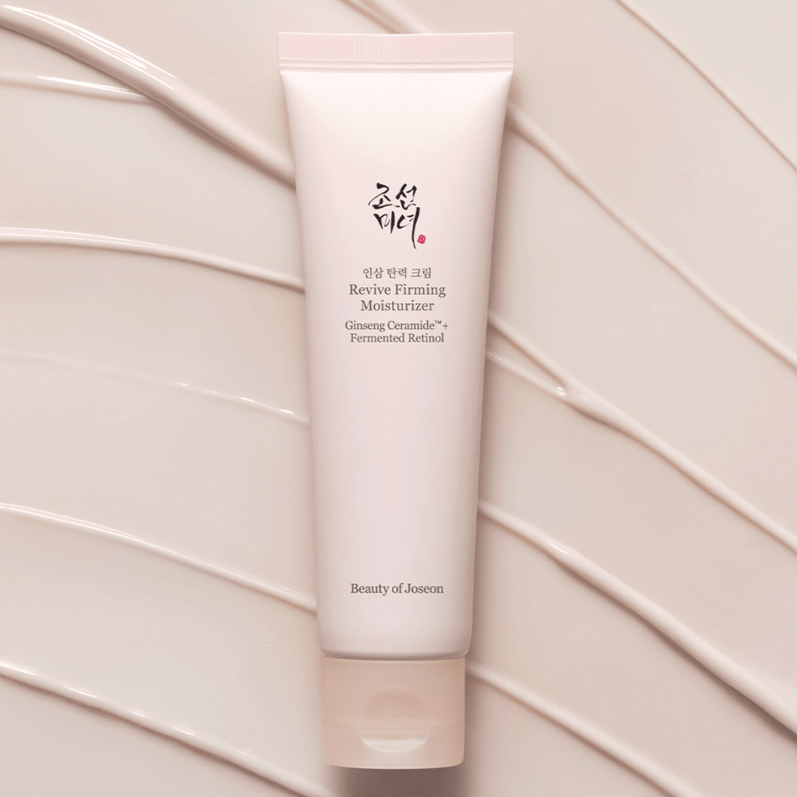 Tube of Beauty of Joseon Revive Firming Moisturizer on a beige background