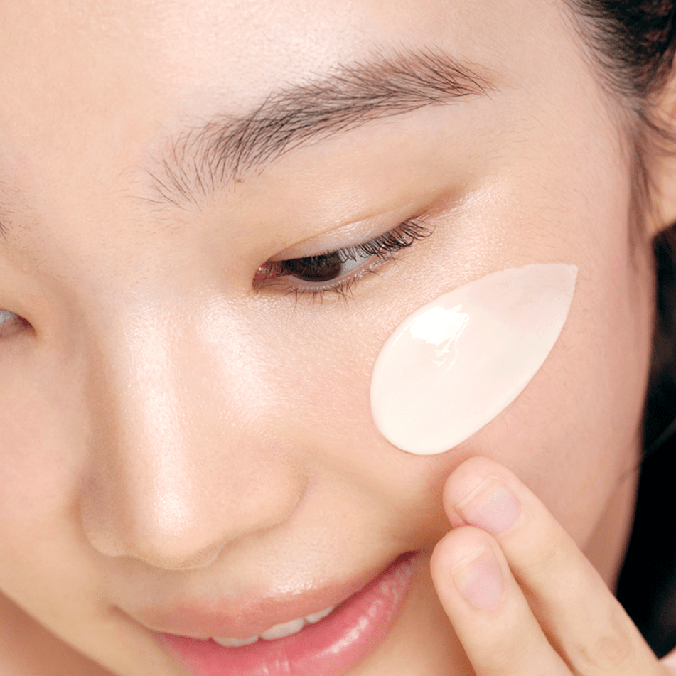 Person applying a patch under their eye