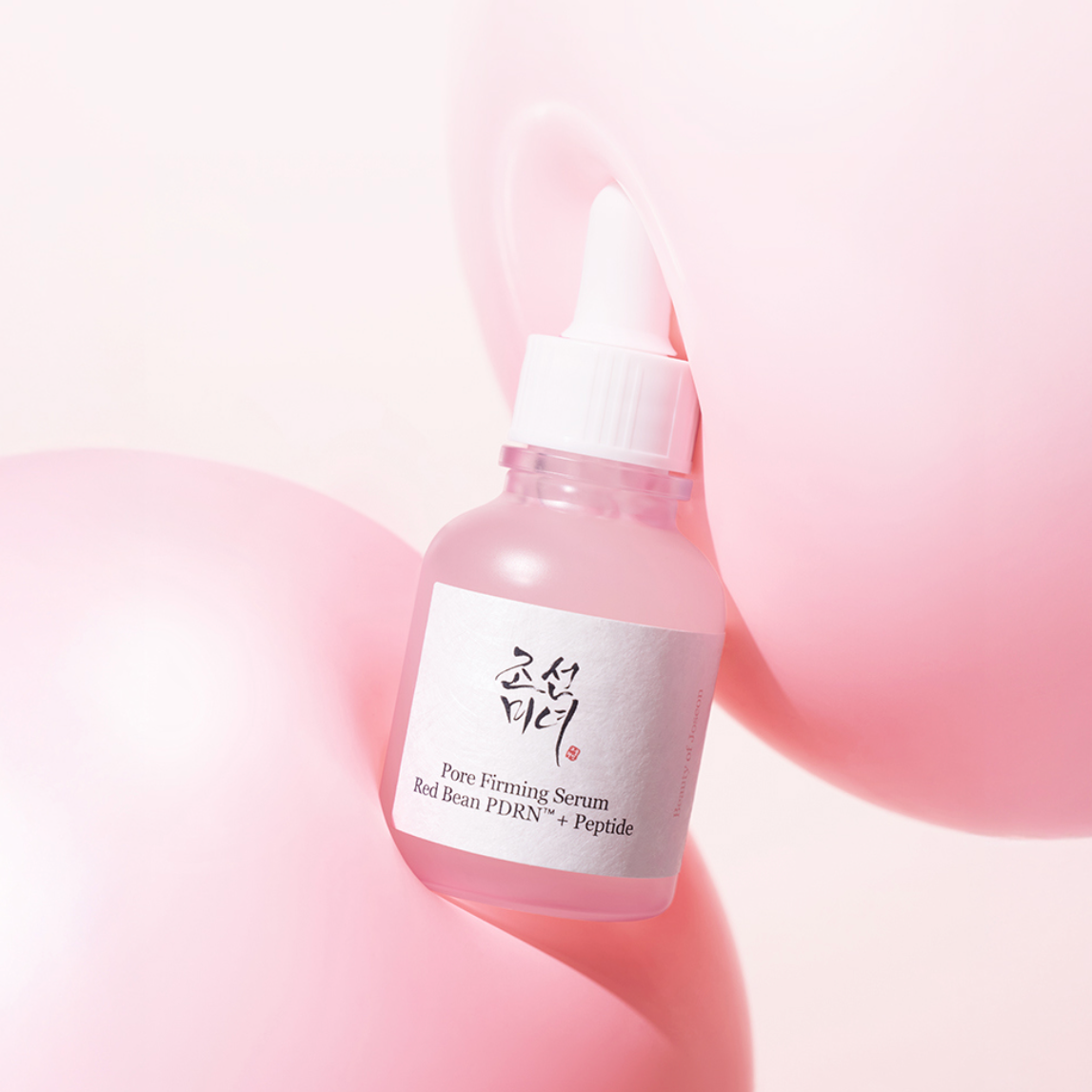 BEAUTY OF JOSEON Pore Firming Serum Red Bean PDRN+Peptide with a white dropper cap and a white label, styled on a soft pink background with abstract pink shapes.