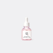 A small glass dropper bottle of BEAUTY OF JOSEON Pore Firming Serum Red Bean PDRN+Peptide, filled with a light pink liquid, set against a solid light gray background.