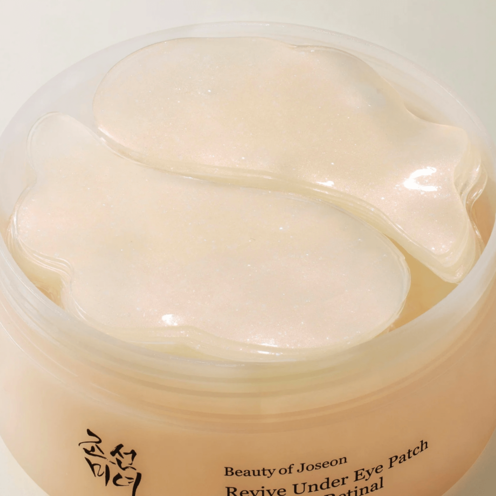 Close-up of a container of Beauty of Joseon Revive Under Eye Patch with visible text.