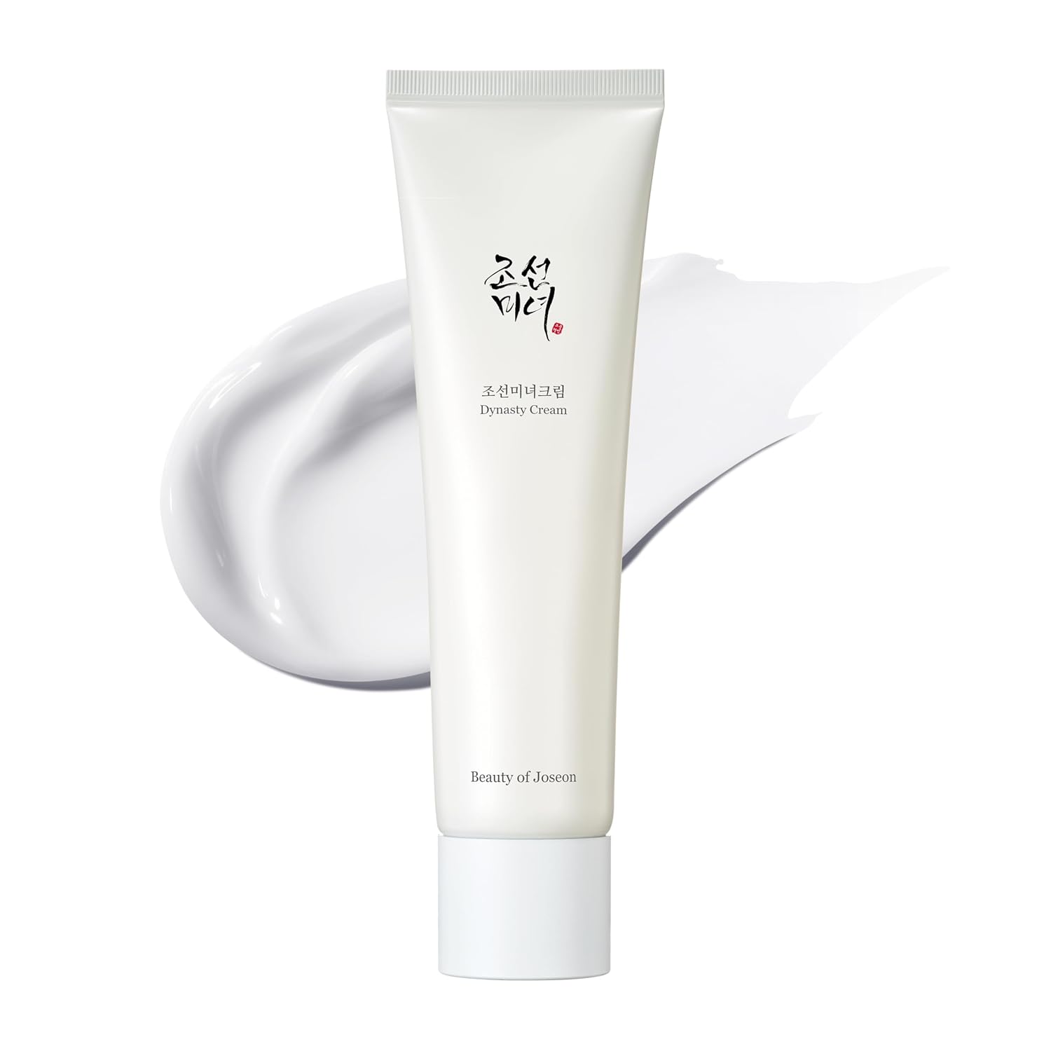 Beauty of Joseon Dynasty Cream in a white squeeze tube, shown with a white cream smear behind it on a white background.