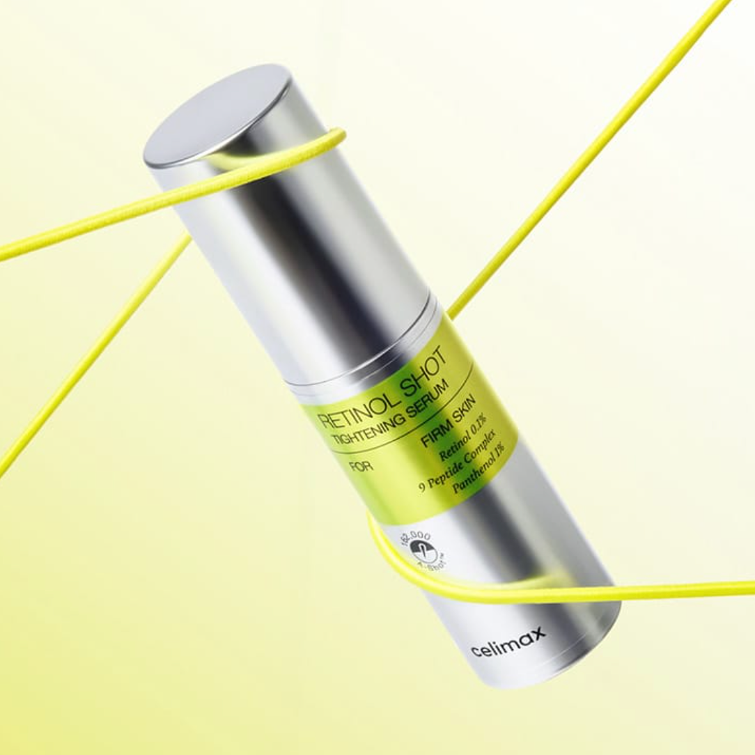 Celimax The Vita A Retinol Shot Tightening Serum bottle with yellow string on yellow gradient background
