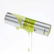 yellow liquid dropping on Celimax The Vita A Retinol Shot Tightening Serum bottle on white background