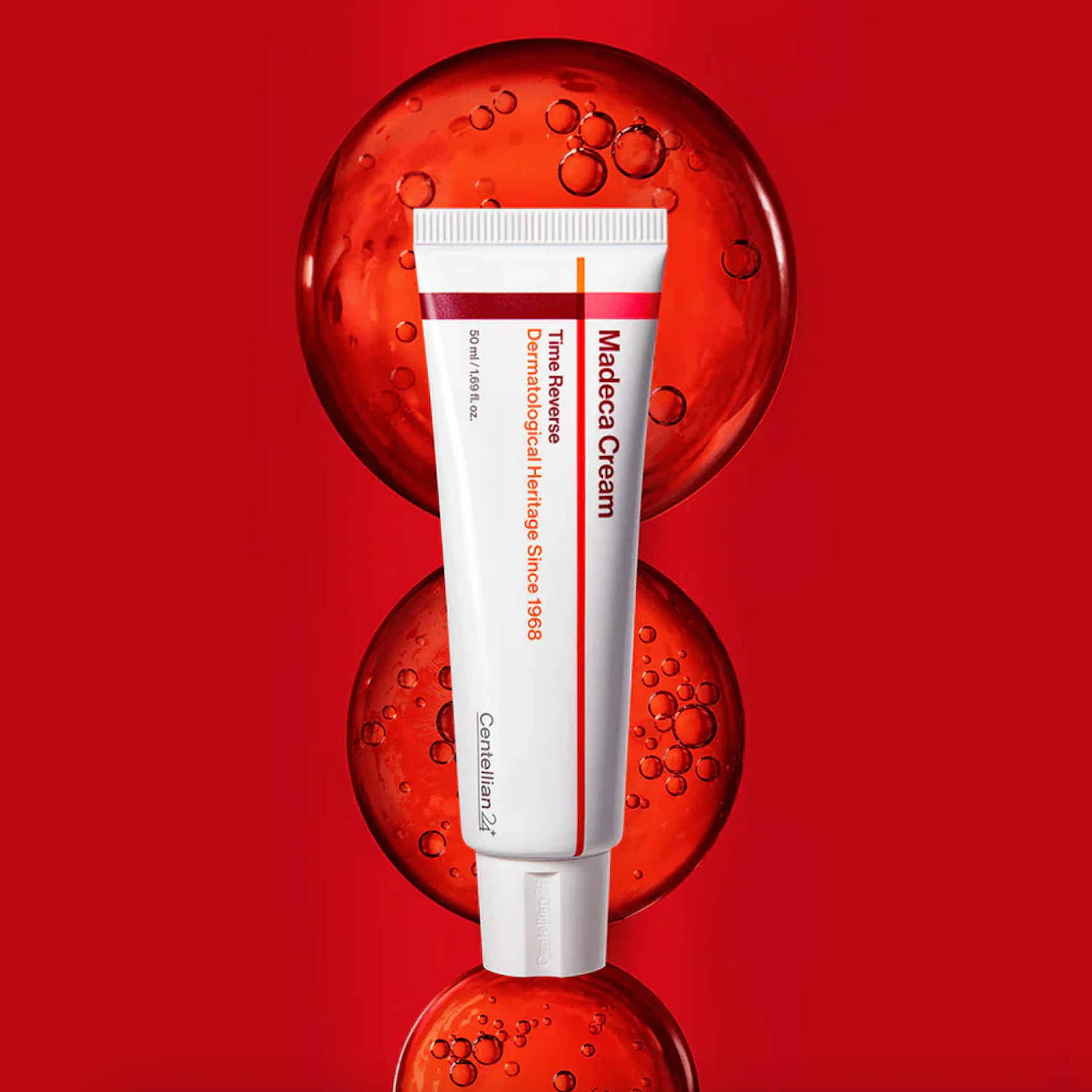 Centellian24 Madeca cream time reverse tube on red background