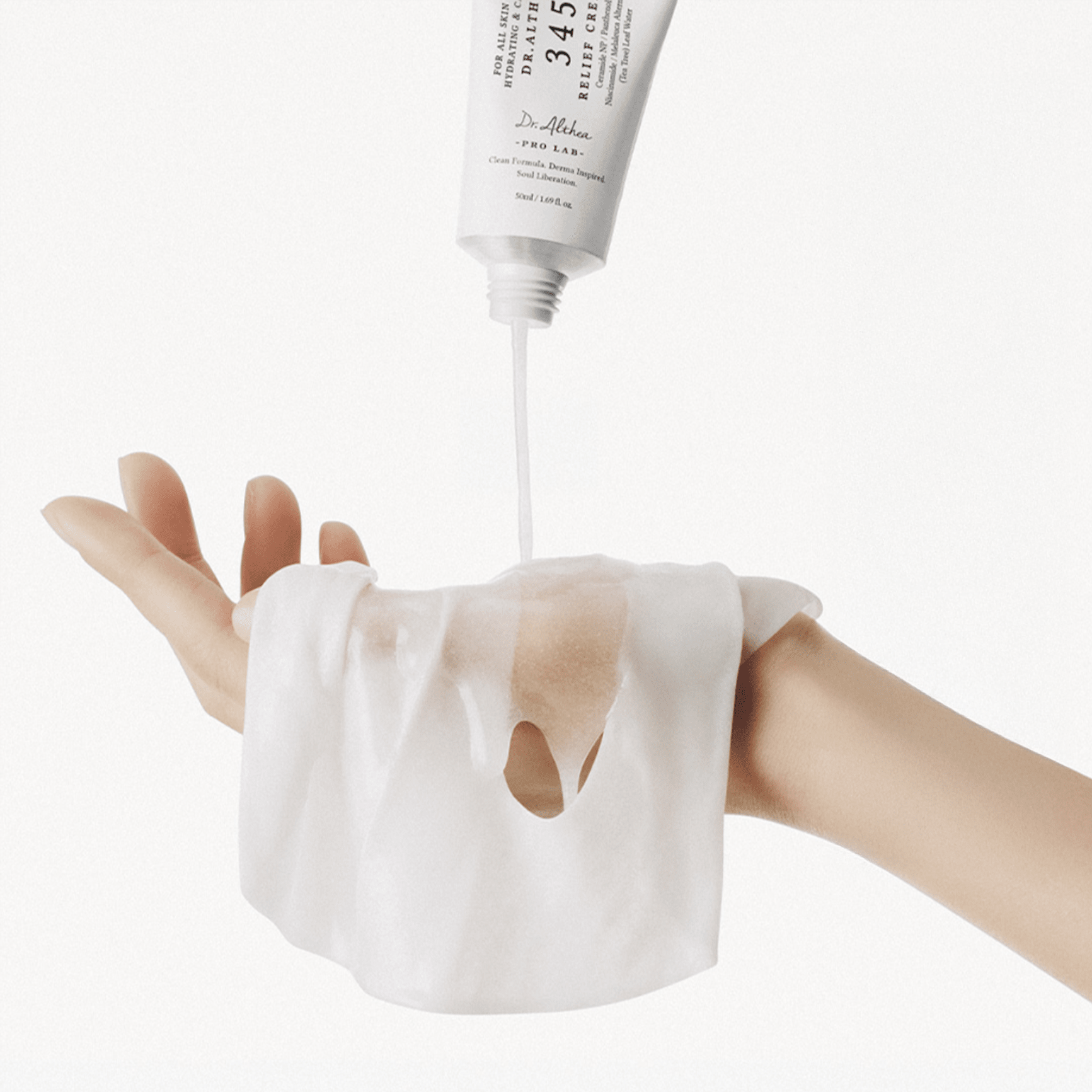 Hand applying a white cream from a tube labeled Dr. Althea 345 Cream on a white background
