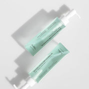 Two bottles of DR. ALTHEA Gentle Pore Cleansing Oil  on a light gray background
