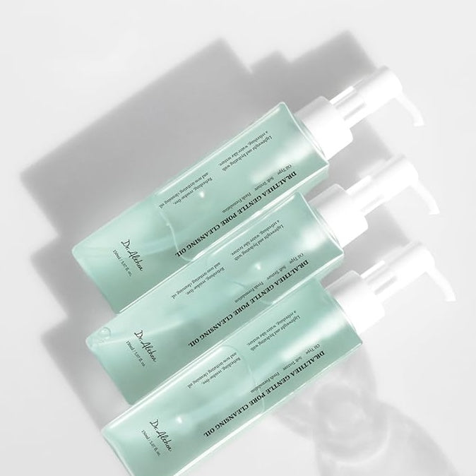 Three green DR. ALTHEA Gentle Pore Cleansing Oil bottles with text on a white background