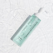 DR. ALTHEA Gentle Pore Cleansing Oil bottle with pump on a textured white background