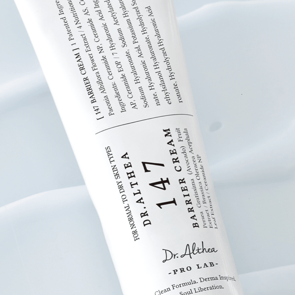 Dr. Althea 147 Barrier Cream tube with label on a cream texture background