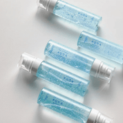 Multiple bottles of Dr. Althea Aqua Marine Jelly Mist on a light background