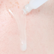Close-up of a skincare product being applied to skin