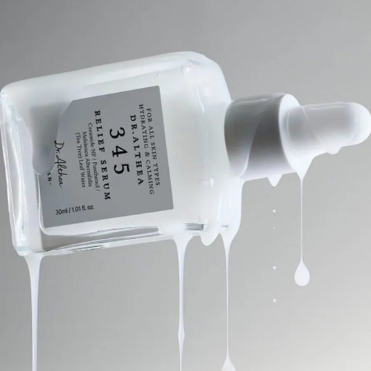 Dr. Althea relief serum bottle with dropper on a gray background