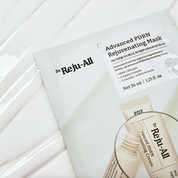 A flat-lay view of a Dr. Reju-All Advanced PDRN Rejuvenating Mask packet, showing the white packaging with black text and a graphic of a cream tube, set against a clean white background.