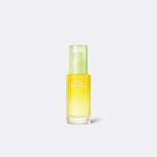 A bottle of Goodal Green Tangerine Vita C Dark Spot Care Serum with a yellowish liquid visible through the clear glass.
