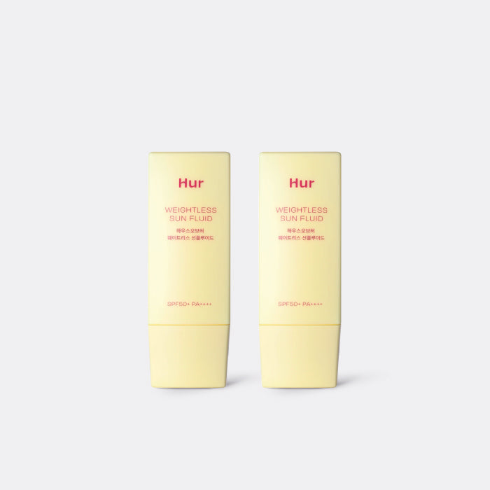 Two yellow HOUSE OF HUR Weightless Sun Fluid SPF50+ 1+1 Twin Pack bottles labeled 'Hur' on a white background