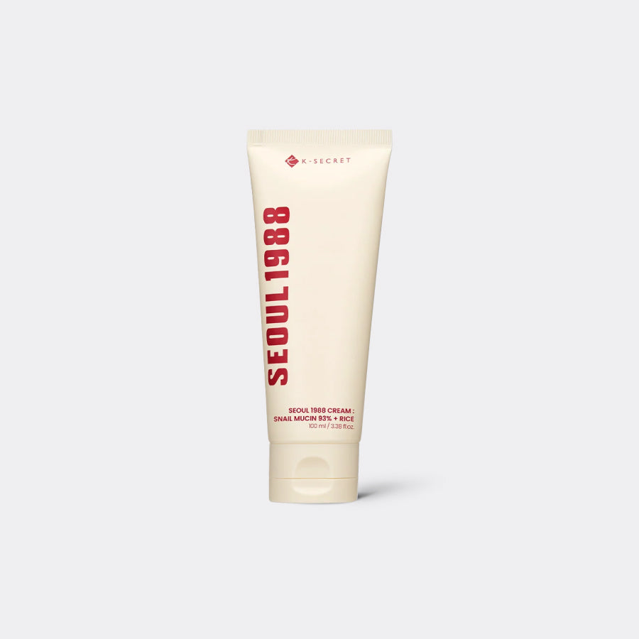 A squeeze tube of K-SECRET Seoul 1988 Cream: Snail Mucin 93% + Rice, standing upright against a light gray background.