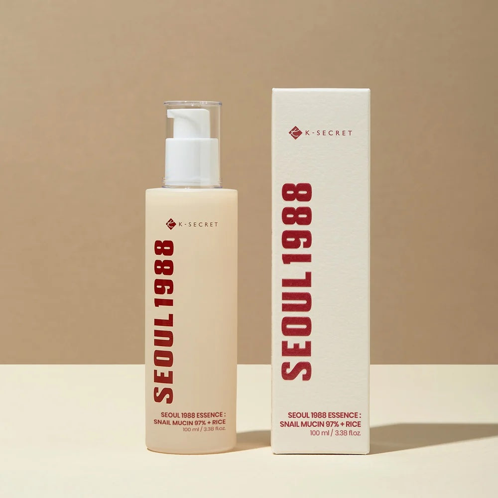 K-SECRET SEOUL 1988 Essence Snail Mucin 97% + Rice with packaging on a beige background