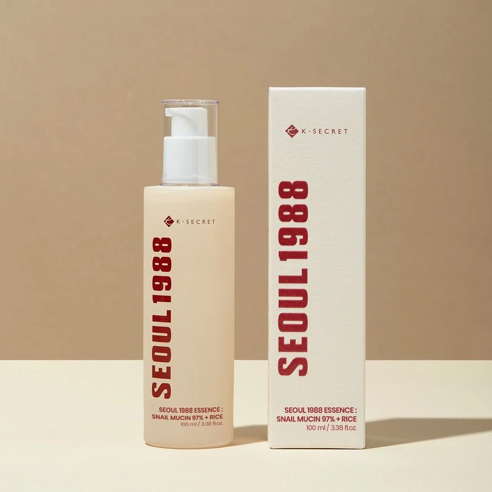 K-SECRET SEOUL 1988 Essence Snail Mucin 97% + Rice with packaging on a beige background