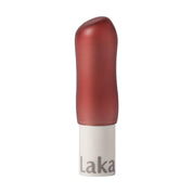 red lip balm with white base on a white background