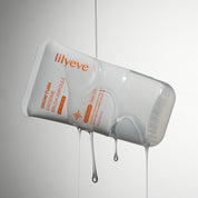 LILYEVE Grow Turn Exosome Brush Ampoule with visible droplets on a gray background