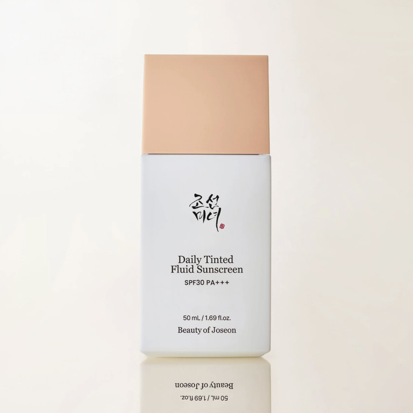 Beauty of Joseon Daily Tinted Fluid Sunscreen bottle on a light beige background