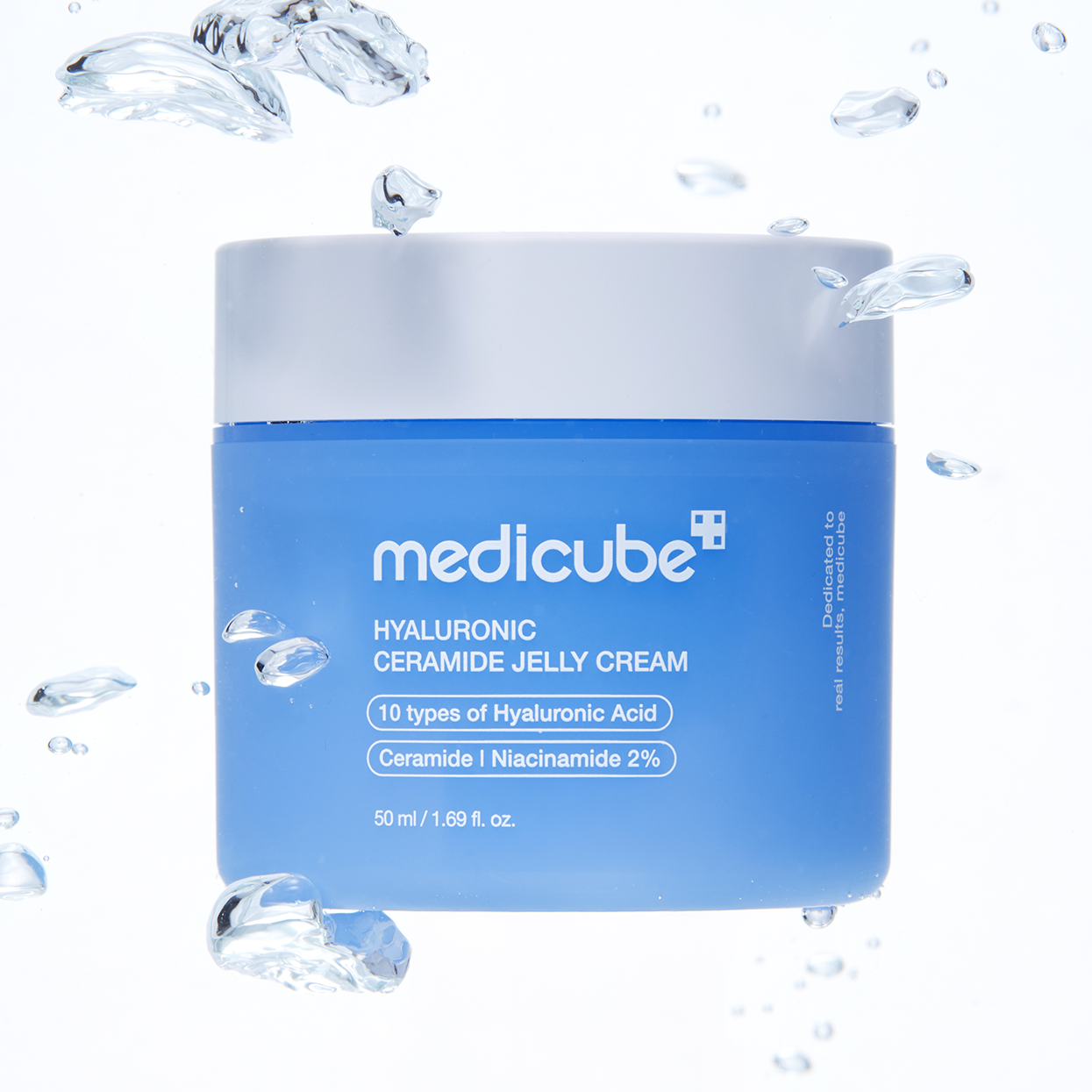 A blue and white jar of medicube Hyaluronic Ceramide Jelly Cream, surrounded by floating water droplets on a clean white background.