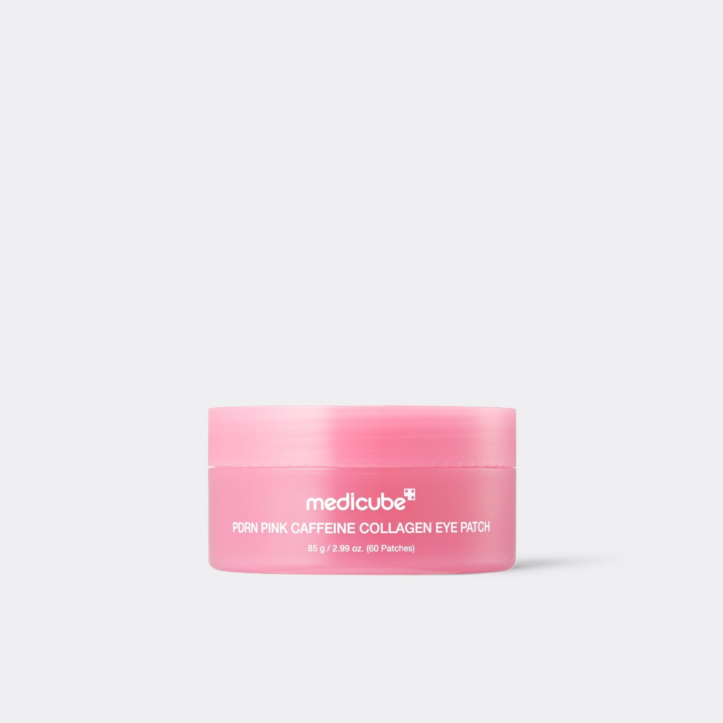 A pink cosmetic jar of medicube PDRN PINK CAFFEINE COLLAGEN EYE PATCH on a light gray background.