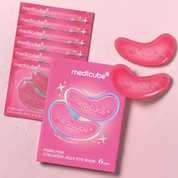 Six pink packets of Medicube PDRN Pink Collagen Jelly Eye Masks are arranged on a light pink background, with two translucent pink jelly eye masks displayed to the right. The packaging features white and blue branding and text.