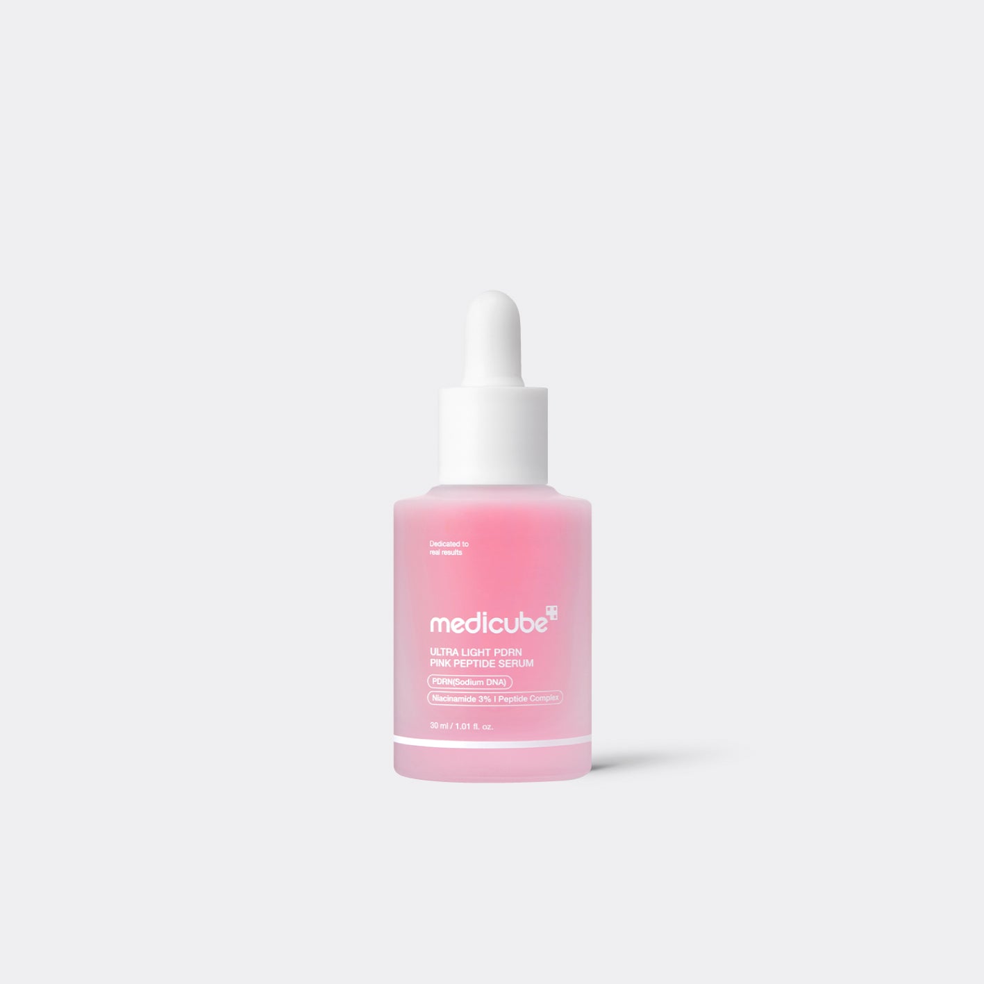 A bottle of medicube Ultra Light Firming Skin Toning Serum with a white dropper cap, containing a pink liquid, centered on a light gray background.
